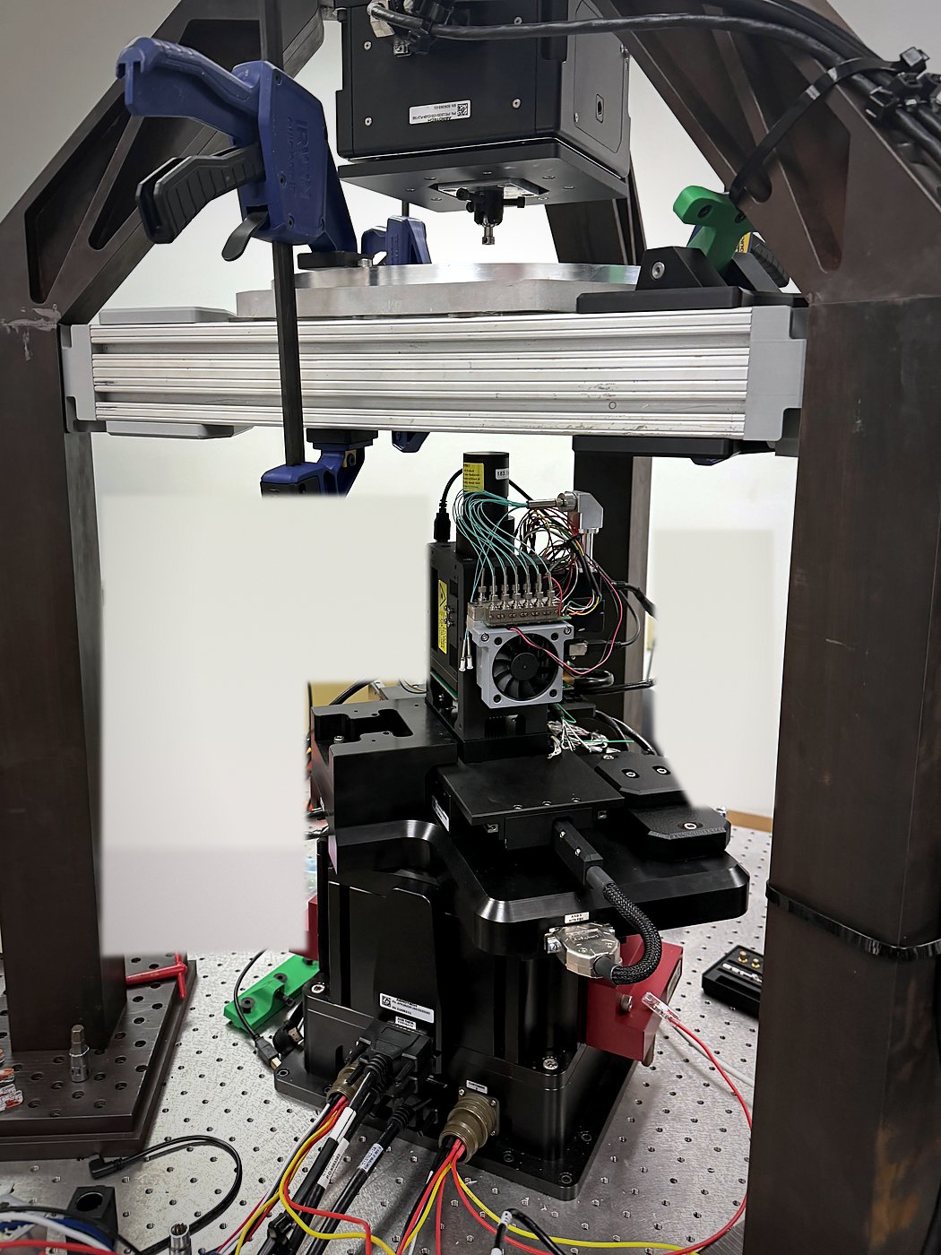 Custom DLP printer frame with projector, motion stages, and build platform